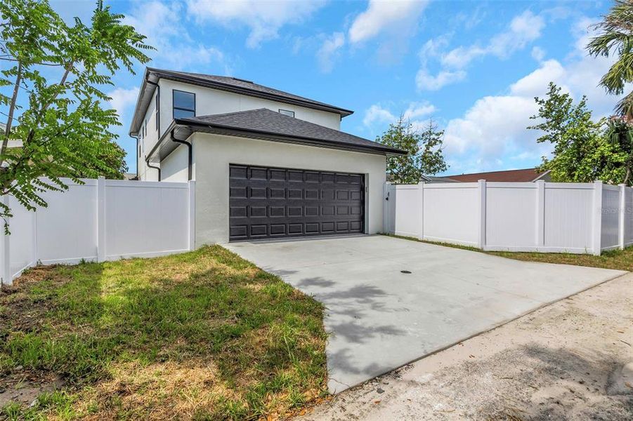 Front exterior of a new home in , Tampa, FL, highlighting curb appeal (Image 10).