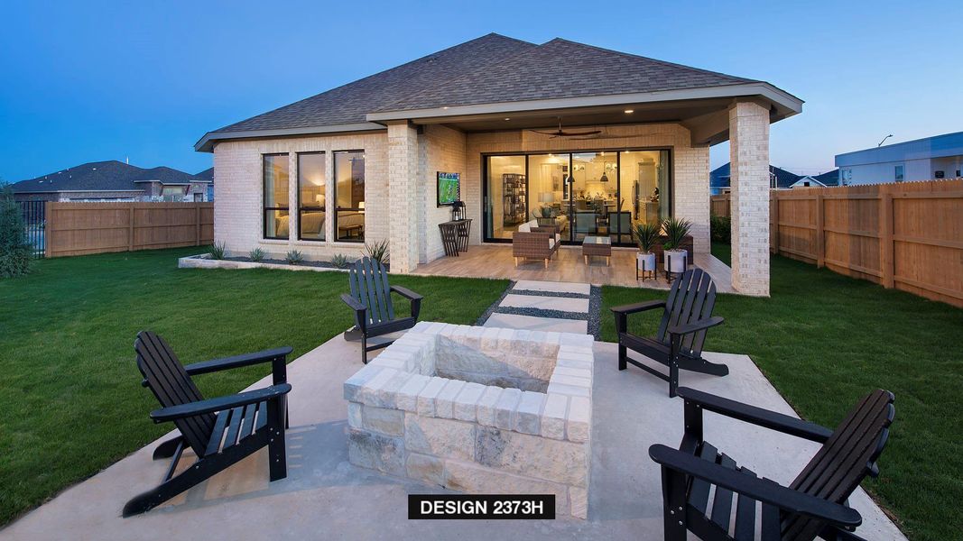 Rear view of property with brick siding, a ceiling fan, roof with shingles, and a patio Rear view of property with brick siding, a ceiling fan, roof with shingles, and a patio