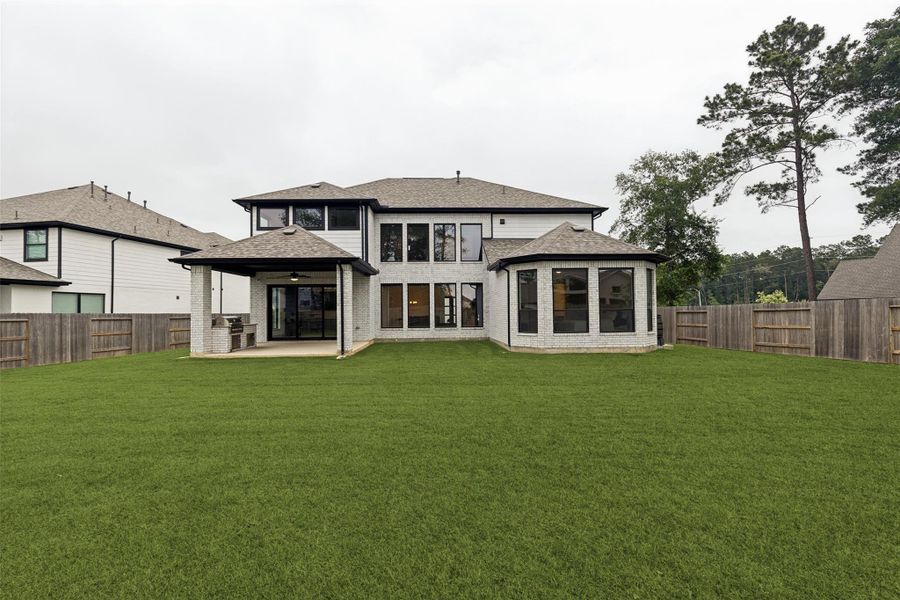Exterior details and patio area of a home in , Conroe (Image 30).