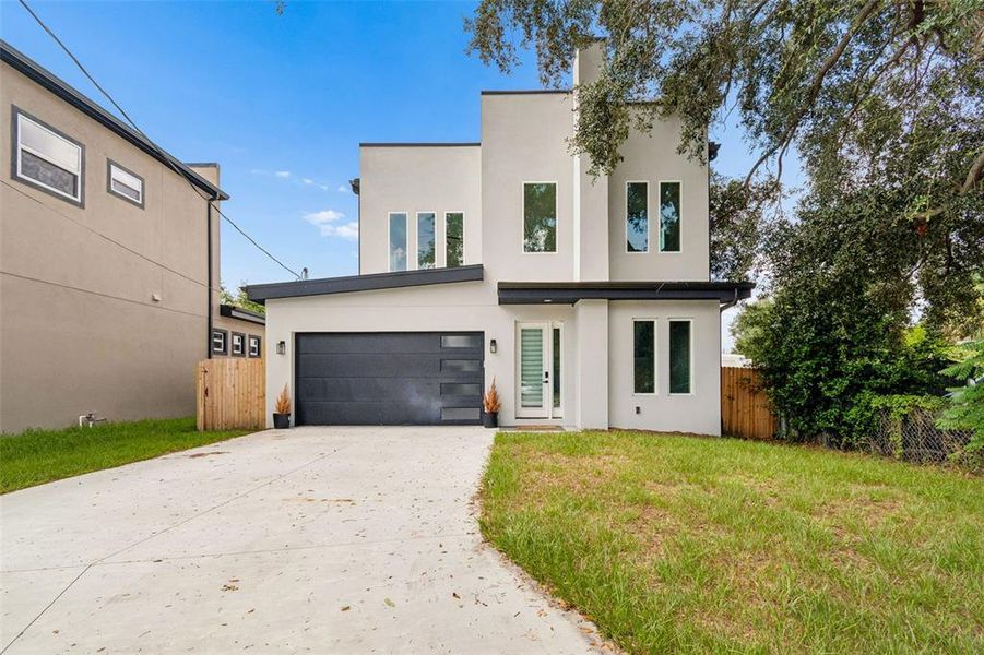 Front exterior of a new home in , Tampa, FL, highlighting curb appeal (Image 30).
