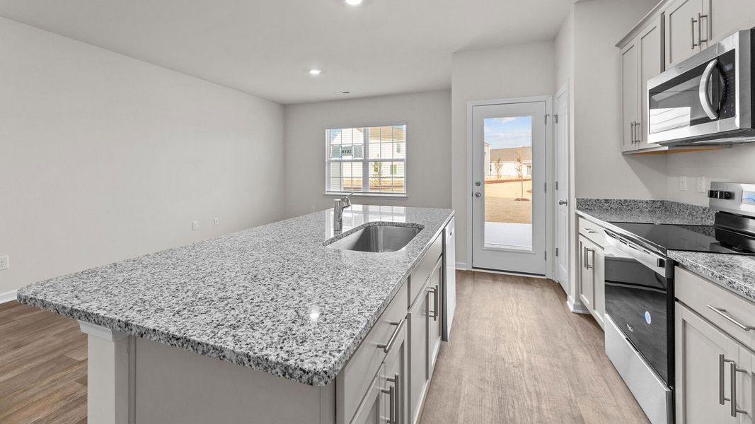 Furnished interior view inside a new home in The Townes at Ridgewood Farms, Winterville (Image 5).