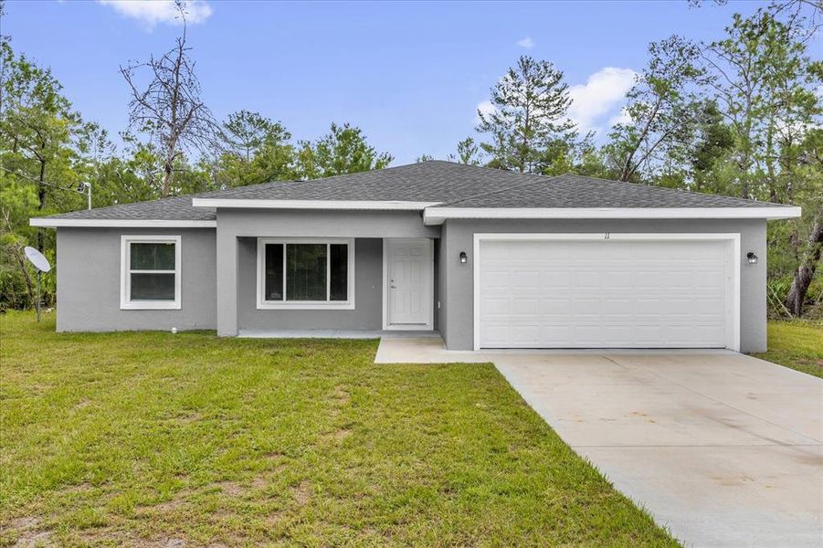 Front exterior of a new home in , Ocklawaha, FL, highlighting curb appeal (Image 21). Front exterior of a new home in , Ocklawaha, FL, highlighting curb appeal (Image 21).