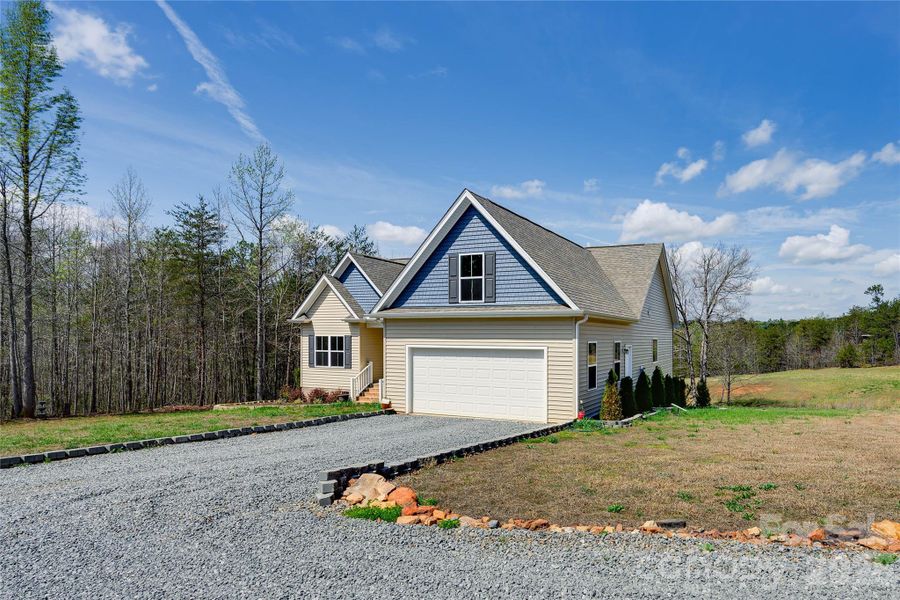Front exterior of a new home in , Bostic, NC, highlighting curb appeal (Image 27).