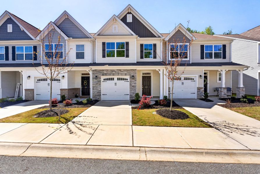 Front exterior of a new home in Fairview Village Townhomes, Simpsonville, SC, highlighting curb appeal (Image 1). Front exterior of a new home in Fairview Village Townhomes, Simpsonville, SC, highlighting curb appeal (Image 1).