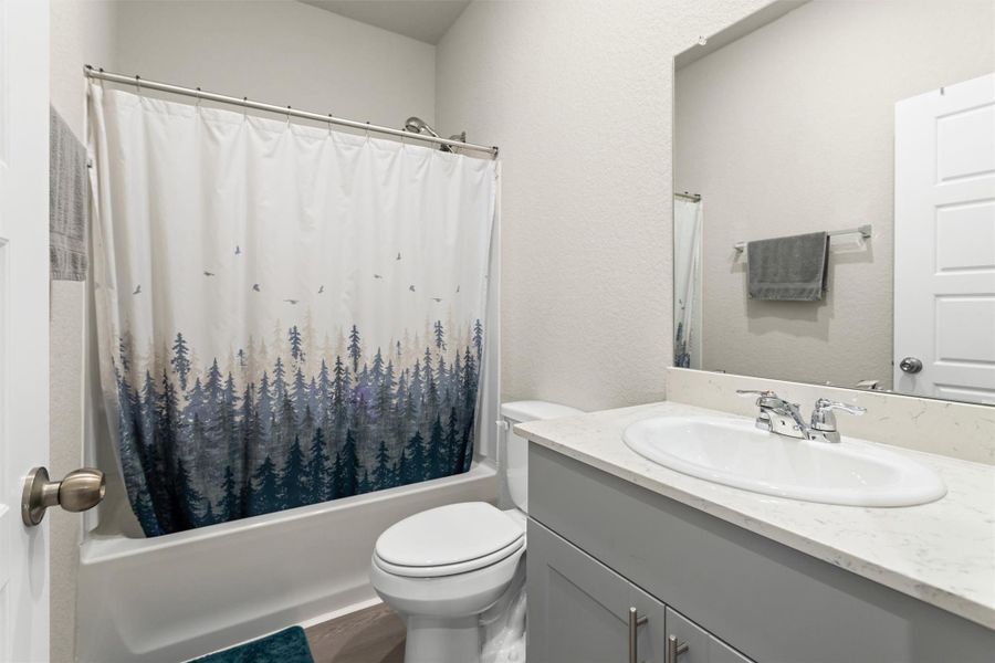 Guest bathroom has tub/shower combo across from secondary bathrooms Guest bathroom has tub/shower combo across from secondary bathrooms