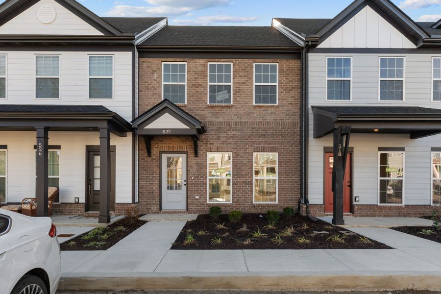 Front exterior of a new home in Oxford Station, Gallatin, TN, highlighting curb appeal (Image 1).