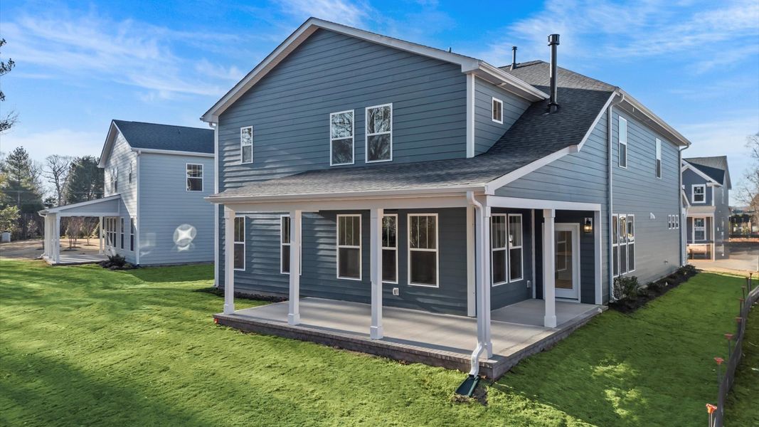 Notable exterior includes a rear covered porch designed for year-round enjoyment