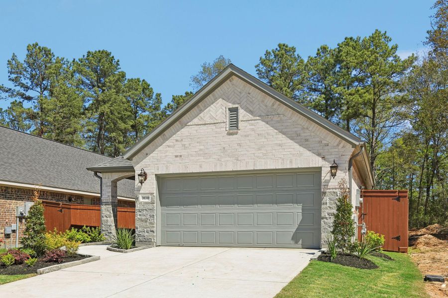 Front exterior of a new home in Woodhavyn 40', Magnolia, TX, highlighting curb appeal (Image 19).