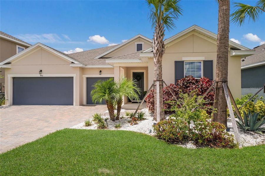 Front exterior of a new home in Seaire, Parrish, FL, highlighting curb appeal (Image 24). Front exterior of a new home in Seaire, Parrish, FL, highlighting curb appeal (Image 24).