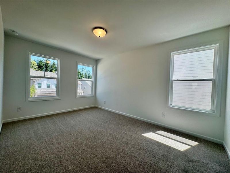 Spacious, unfurnished interior of a new home in Eastlyn Crossing, Flowery Branch (Image 19).