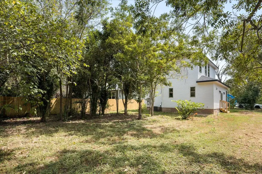 Front exterior of a new home in , Smithville, TX, highlighting curb appeal (Image 1).