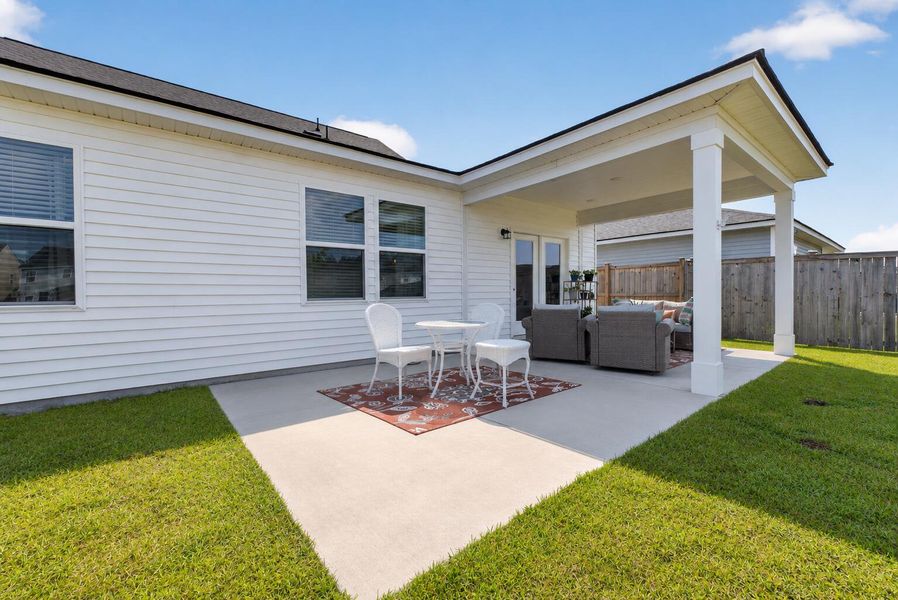 Exterior details and patio area of a home in Sanctuary Cove at Cane Bay, Summerville (Image 3).