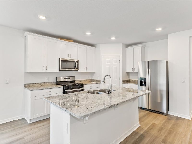 Kitchen in the Daphne floorplan at 2930 Sunstar Drive in The Reserve at Twin Lakes