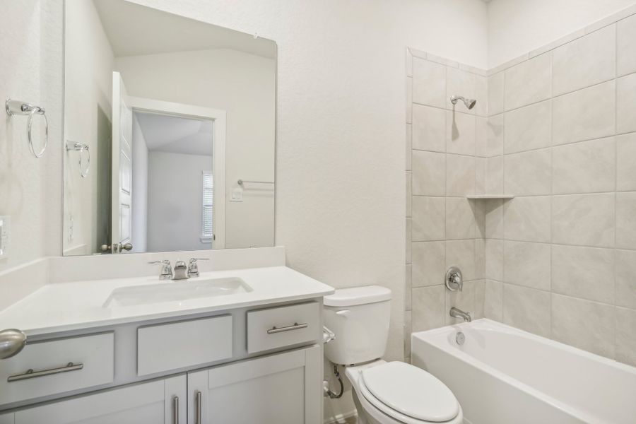 Guest bathroom in the Hughes floorplan at a Meritage Homes community.