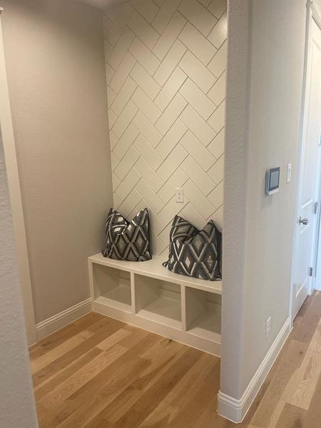 Mudroom with wood finished floors and baseboards Mudroom with wood finished floors and baseboards