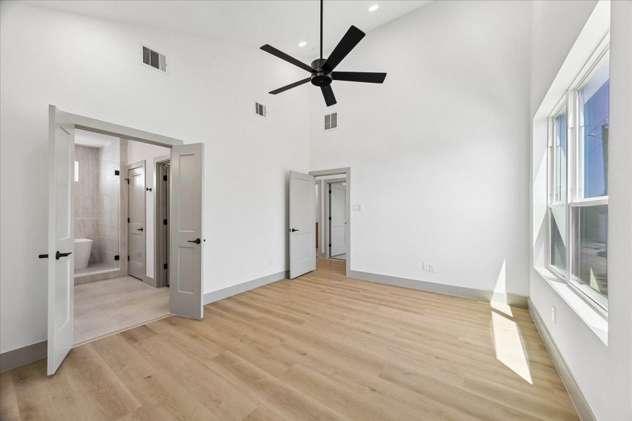 Double doors lead to the oversized walk in closet and spa inspired ensuite bath, completing this private owner’s sanctuary.