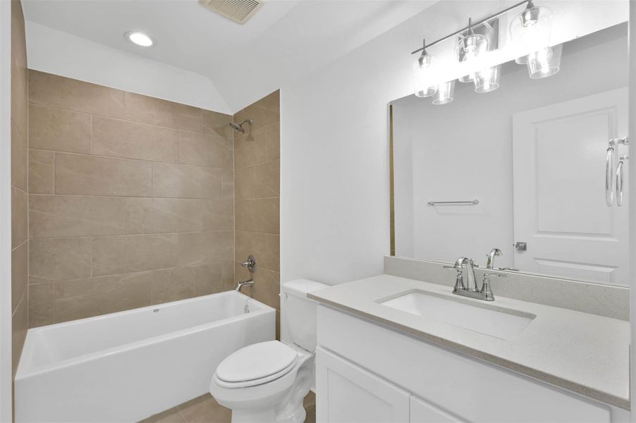 Full bathroom 4 is upstairs with upscale quartz counters and fixtures. Full bathroom 4 is upstairs with upscale quartz counters and fixtures.