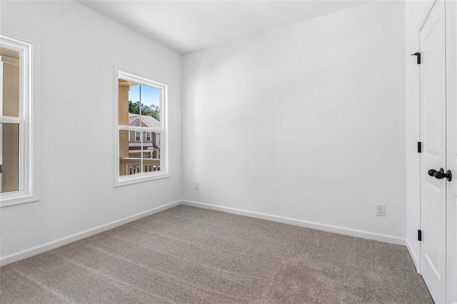 Spacious, unfurnished interior of a new home in Eastlyn Crossing, Flowery Branch (Image 19).