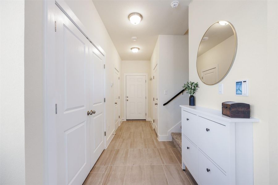 Hallway with baseboards and stairs Hallway with baseboards and stairs