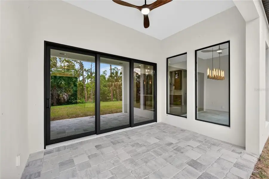 Exterior details and patio area of a home in , North Port (Image 43).