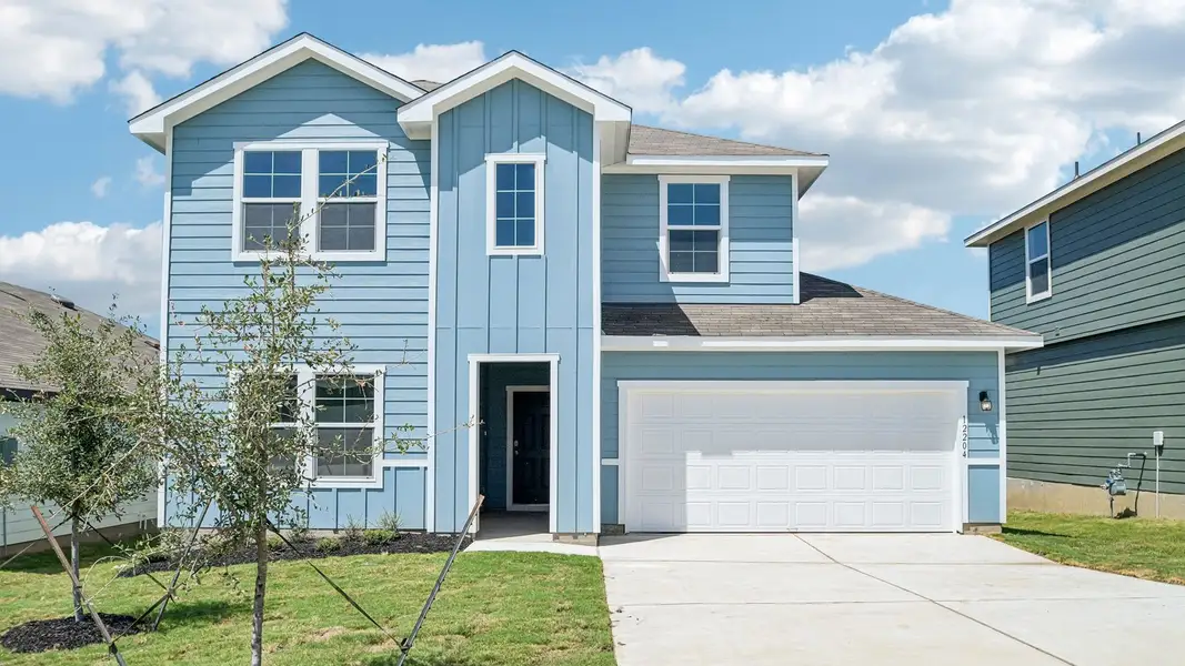 Front exterior of a new home in Durango, Mustang Ridge, TX, highlighting curb appeal (Image 2). Front exterior of a new home in Durango, Mustang Ridge, TX, highlighting curb appeal (Image 2).