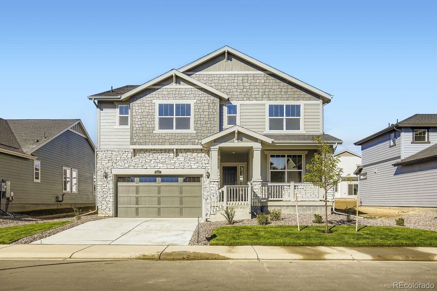 Front exterior of a new home in Riano Ridge: The Monarch Collection, Loveland, CO, highlighting curb appeal (Image 2).