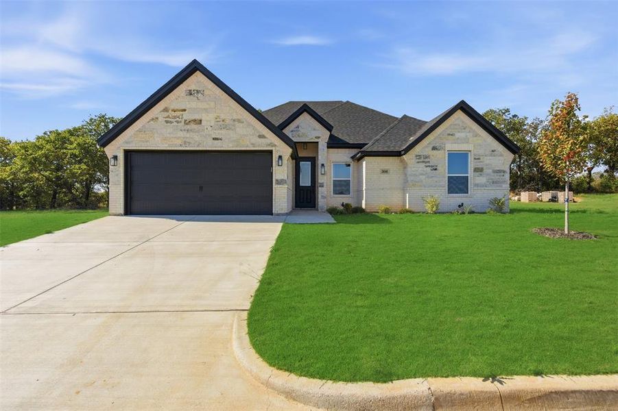Front exterior of a new home in , Tolar, TX, highlighting curb appeal (Image 21). Front exterior of a new home in , Tolar, TX, highlighting curb appeal (Image 21).