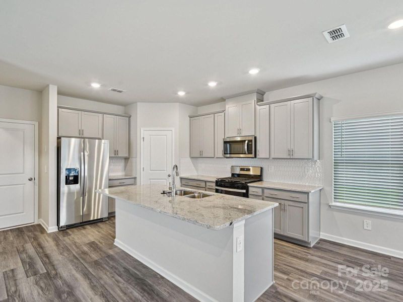 Photo is not of the actual home, but is an inspirational photo of builder’s model home and may depict options, furnishings, and/or decorator features that are not included