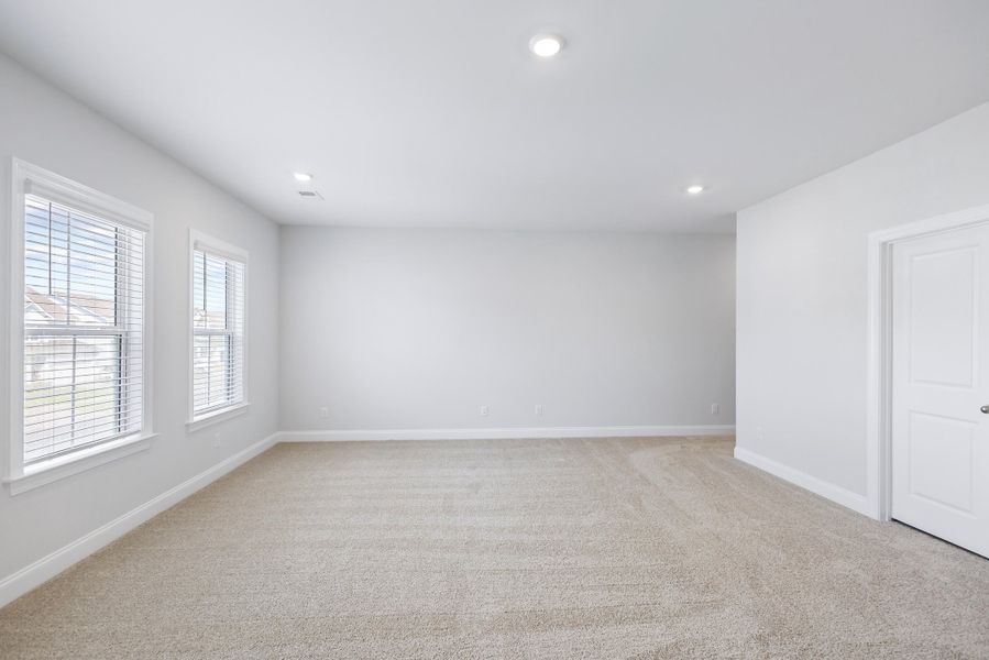 Spacious, unfurnished interior of a new home in Tidewater at Lakes of Cane Bay, Summerville (Image 57).