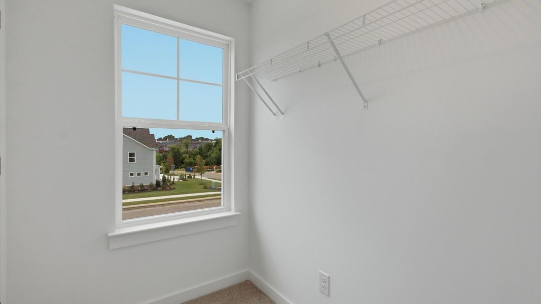 Closet with window and convenient storage spacing Closet with window and convenient storage spacing