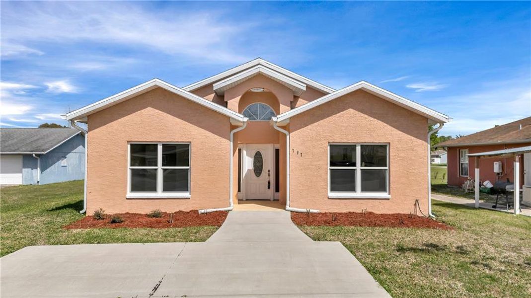 Front exterior of a new home in , New Smyrna Beach, FL, highlighting curb appeal (Image 1). Front exterior of a new home in , New Smyrna Beach, FL, highlighting curb appeal (Image 1).