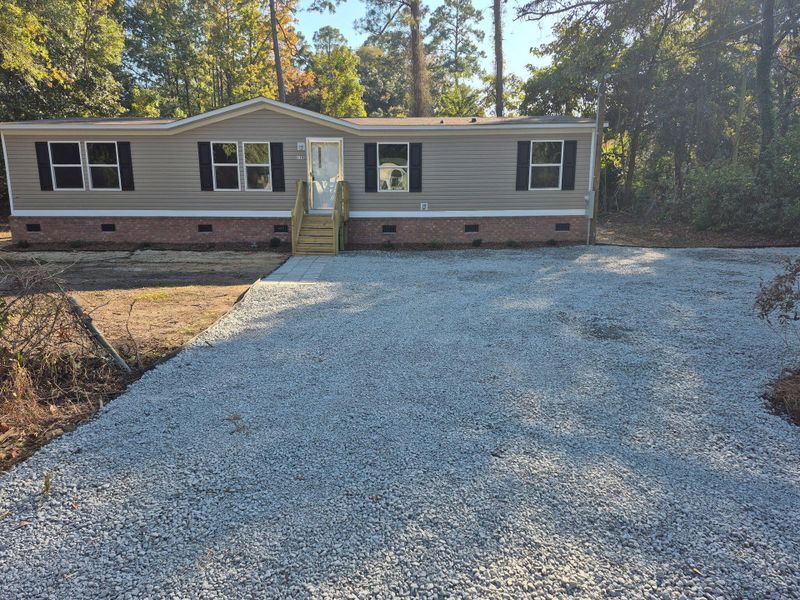 Exterior details and patio area of a home in , Walterboro (Image 1).
