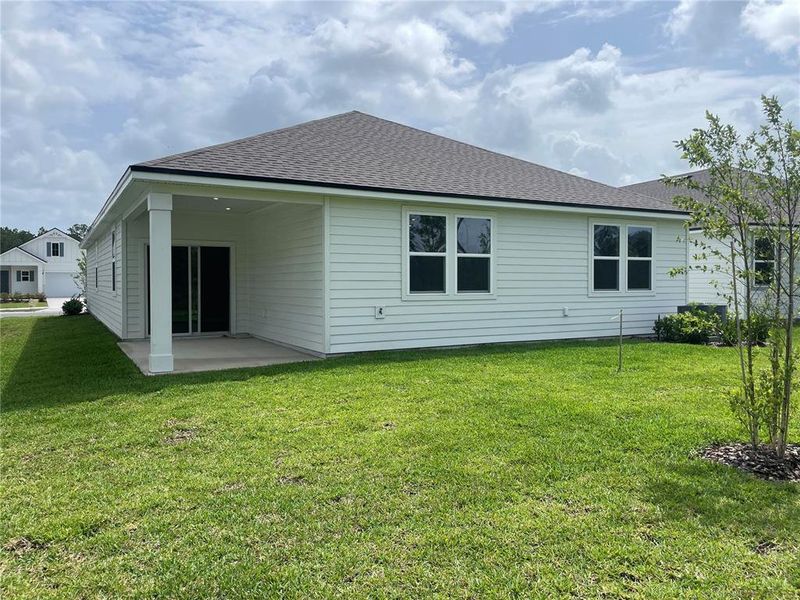 Front exterior of a new home in Magnolia Series at Seminole Palms, Palm Coast, FL, highlighting curb appeal (Image 24).
