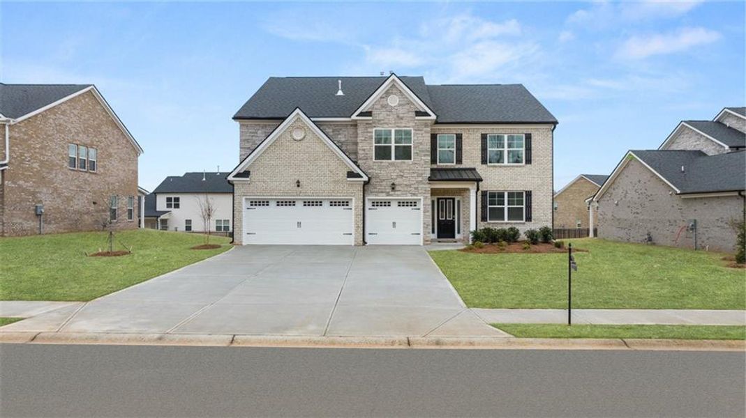 Front exterior of a new home in The Gates at Pates Creek, Hampton, GA, highlighting curb appeal (Image 2).