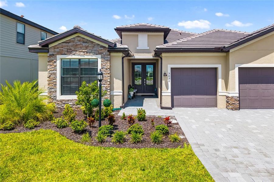 Front exterior of a new home in , Bradenton, FL, highlighting curb appeal (Image 23).