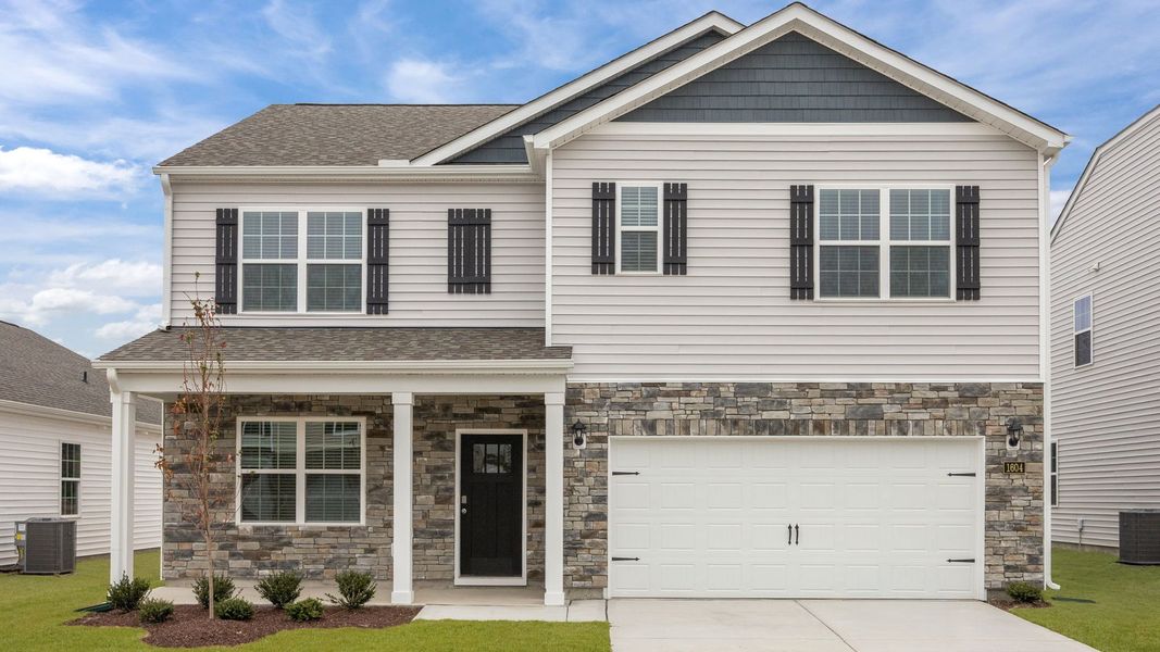 Front exterior of a new home in Ridgewood Farms, Winterville, NC, highlighting curb appeal (Image 1). Front exterior of a new home in Ridgewood Farms, Winterville, NC, highlighting curb appeal (Image 1).