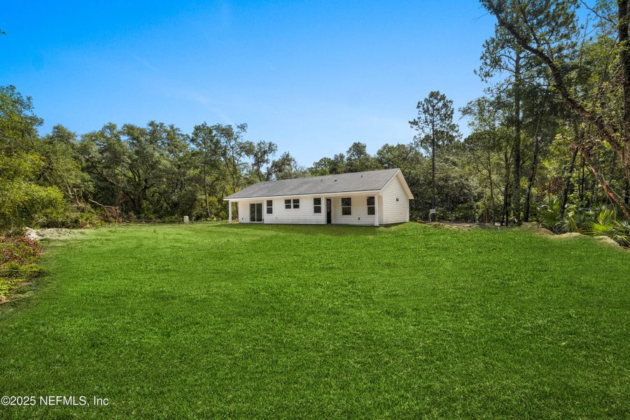 Front exterior of a new home in , Crescent City, FL, highlighting curb appeal (Image 17).
