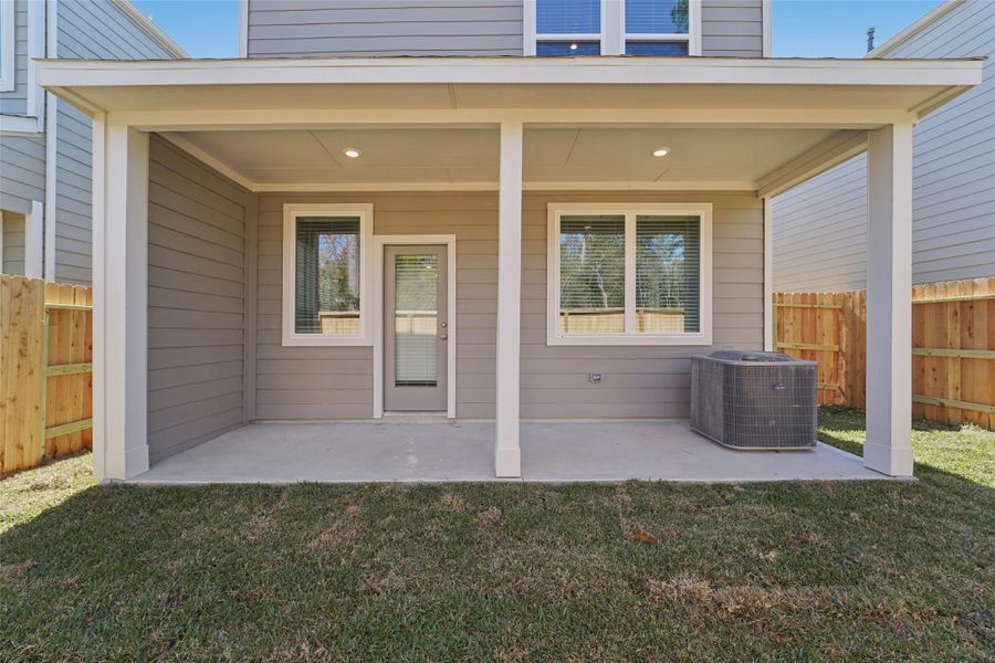 Exterior details and patio area of a home in Pinewood Trails - City Series, Atascocita (Image 21).