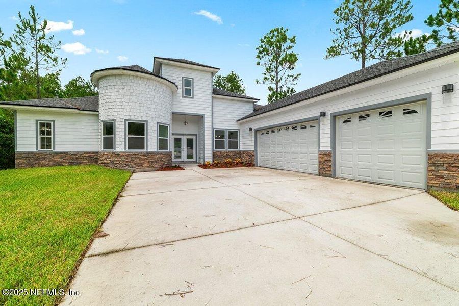 Front exterior of a new home in , Jacksonville, FL, highlighting curb appeal (Image 2).