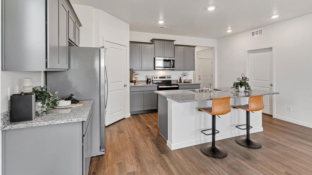 Representative furnished interior of a home built from the NEWCASTLE by D.R. Horton in Tailholt, Severance (Image 4).