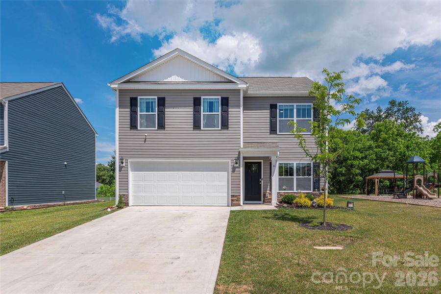 Front exterior of a new home in Patton Cove, Clyde, NC, highlighting curb appeal (Image 23).
