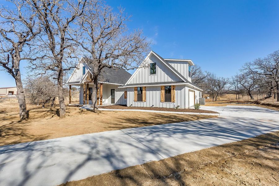 Representative exterior photo of a completed home built from the Dallington by Trinity Classic Homes in Zion Trails, Poolville, TX (Image 6). Representative exterior photo of a completed home built from the Dallington by Trinity Classic Homes in Zion Trails, Poolville, TX (Image 6).