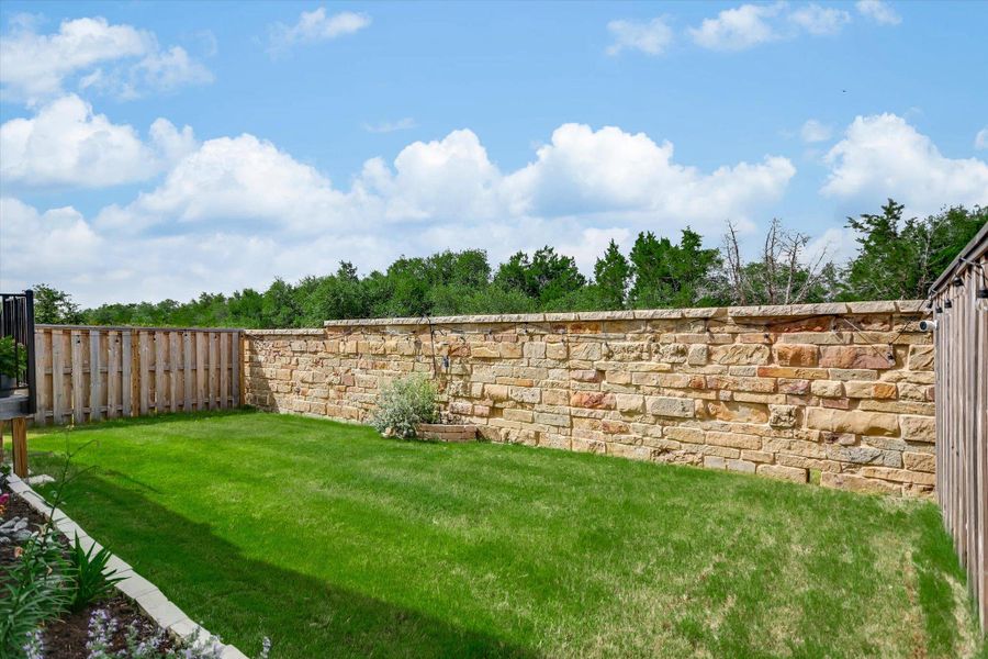 Stone wall along back property line maintained by HOA
