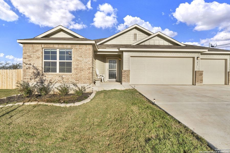 Front exterior of a new home in Chaparral Ranch, Floresville, TX, highlighting curb appeal (Image 19).