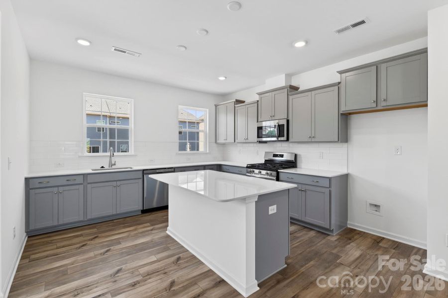Gorgeous kitchen with rear windows and sink