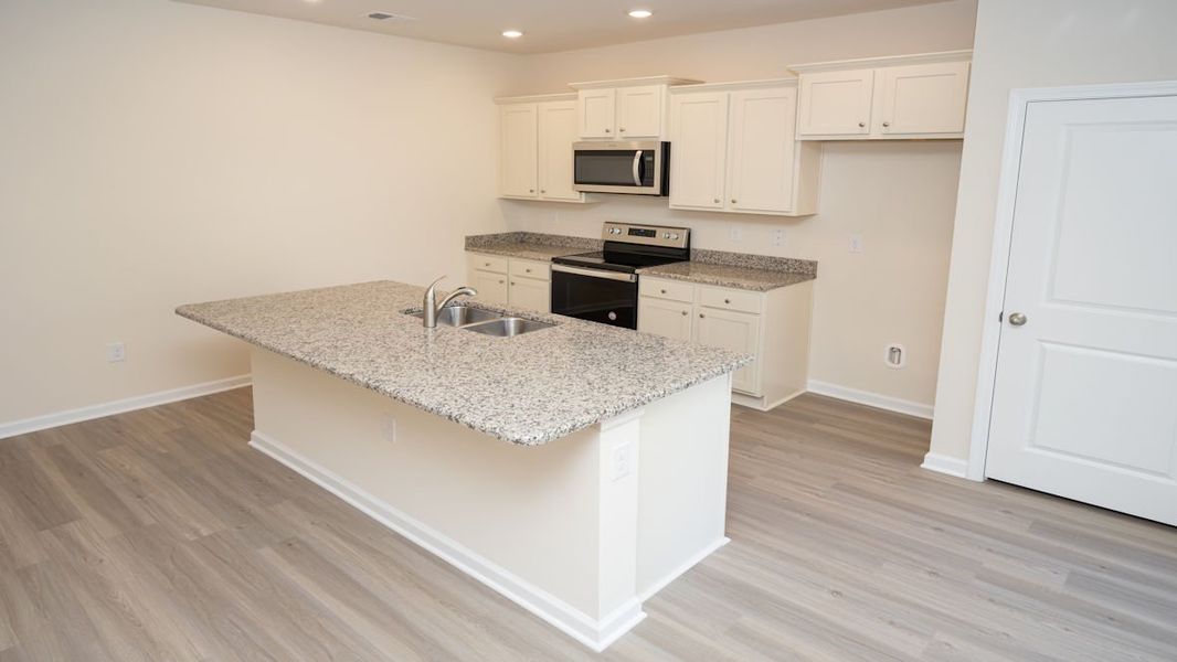 Representative furnished interior of a home built from the KERRY by D.R. Horton in The Reserve at Wild Horse, Conway (Image 10).