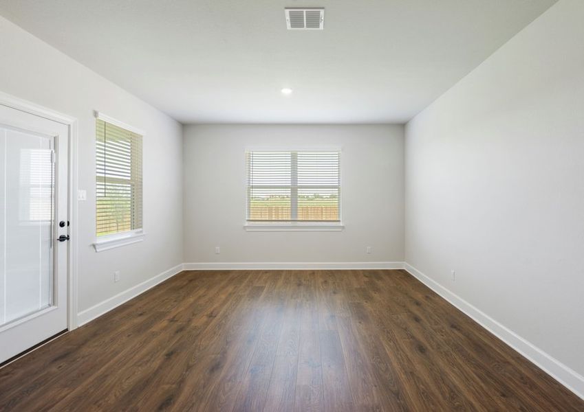 Dining room with a large window facing the backyard