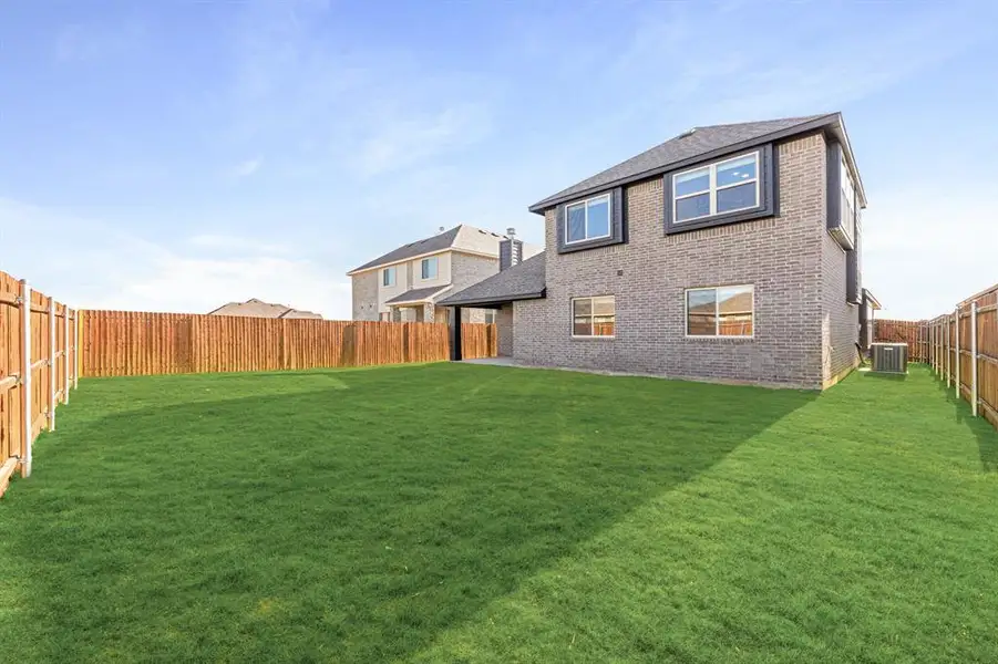 Exterior details and patio area of a home in Star Ranch Classic 50, Godley (Image 3).