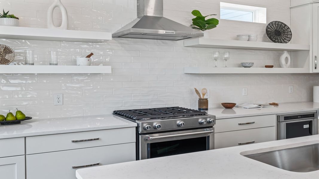 Stylish kitchen in the Sullivan home plan featuring stainless steel appliances, modern cabinetry, and generous prep space.