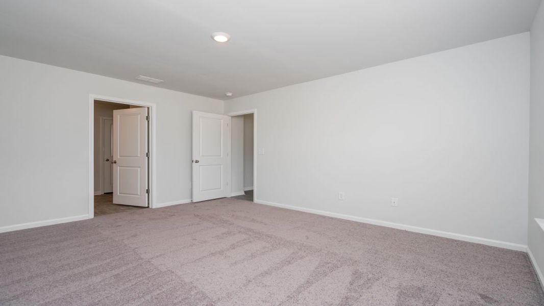 Representative unfurnished interior of a home built from the Cali by D.R. Horton in Jordanville Farms, Galivants Ferry (Image 33).